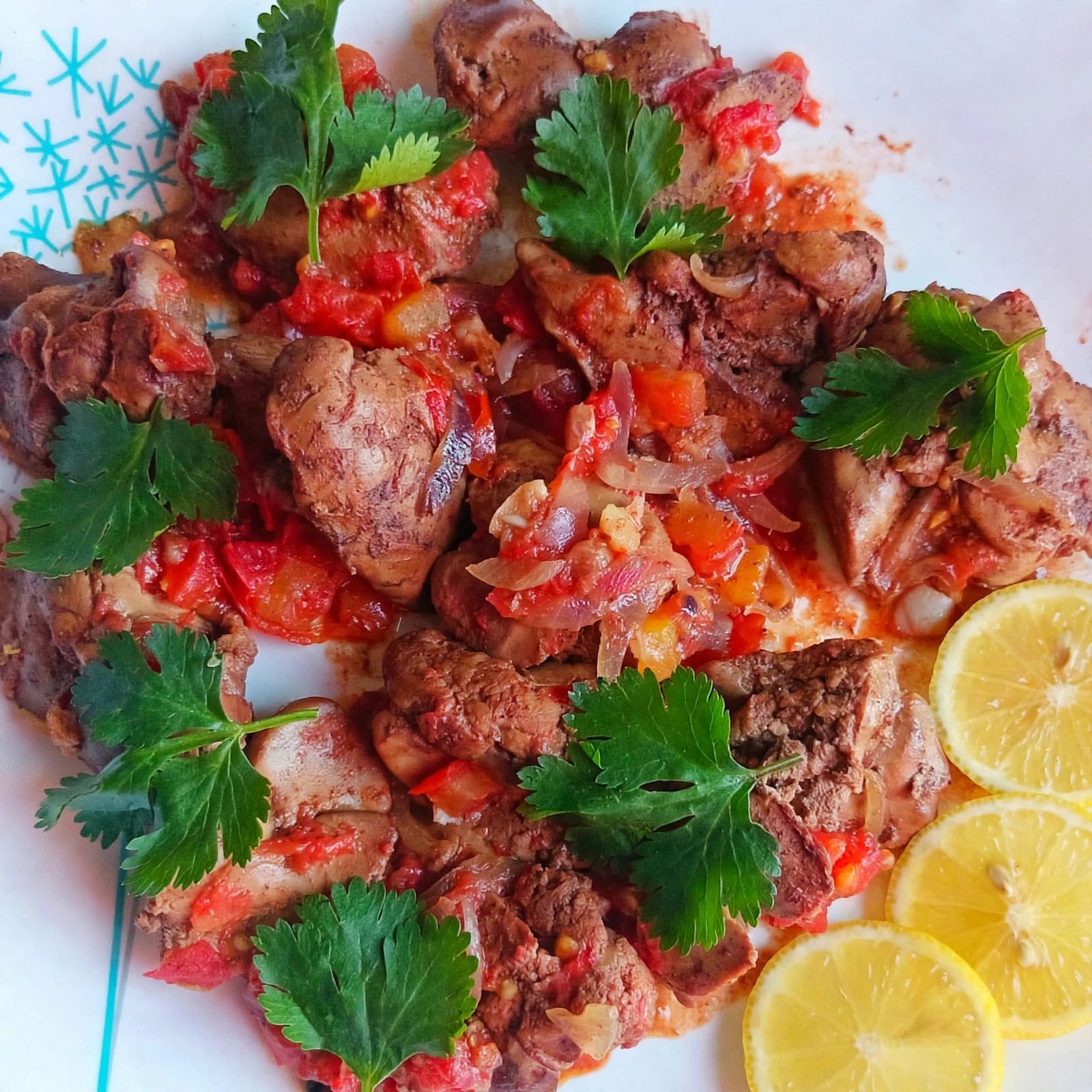 Maureen’s chicken liver with onions, herbs and lemon slices